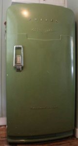 A green refrigerator with a lock Description automatically generated